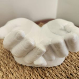 white plaster cupped hands sculpture decorative bowl