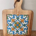 floral wooden hot pad with colorful tile inlay
